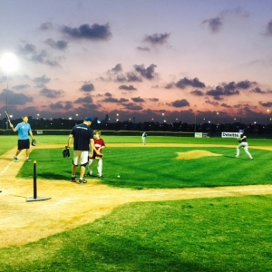 The baseball fields: a self-contained quad of baseball diamonds on a green plot of land in clear view of the Burj Khalifa